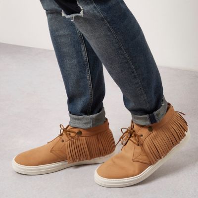 Tan leather fringed desert boots